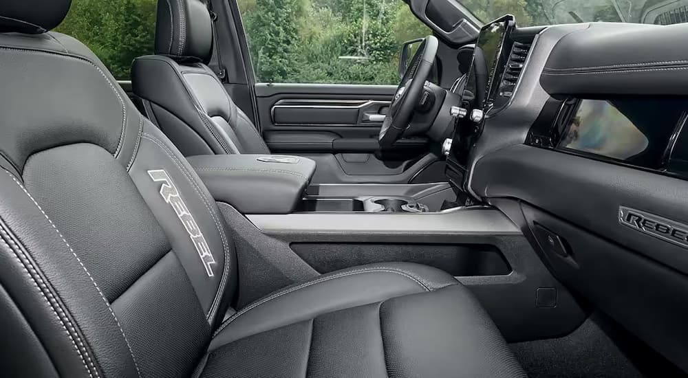 The grey interior and front seats of a 2025 Ram 1500 Rebel at a Ram dealer.