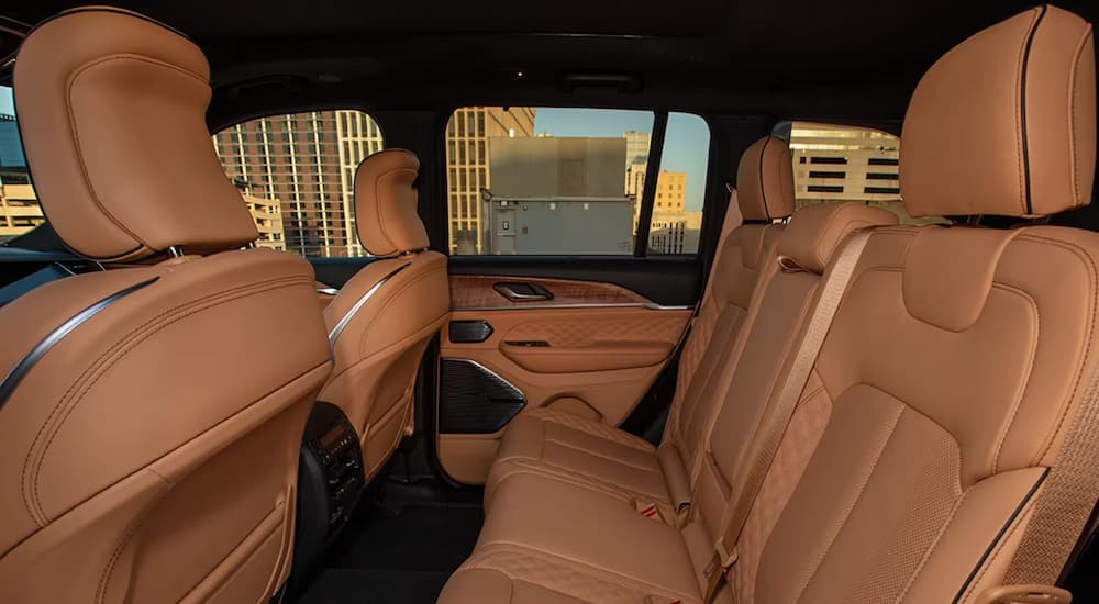 The brown leather second row of seats in a 2024 Jeep Grand Cherokee.
