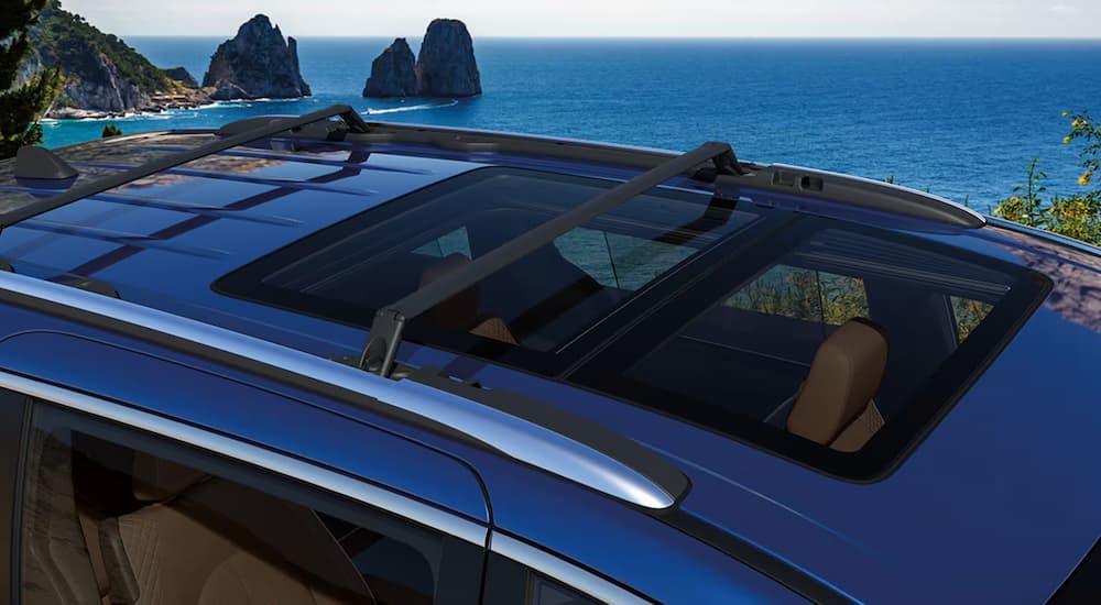 Overhead view of the dual-panel moon roof on a blue 2024 Chrysler Pacifica.
