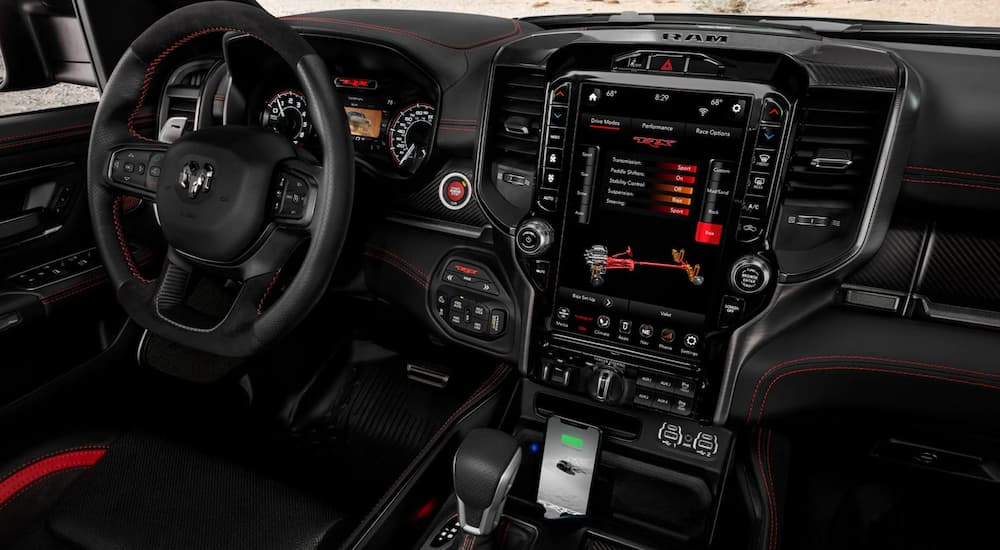 The steering wheel and large infotainment screen in a 2022 Ram 1500 TRX.