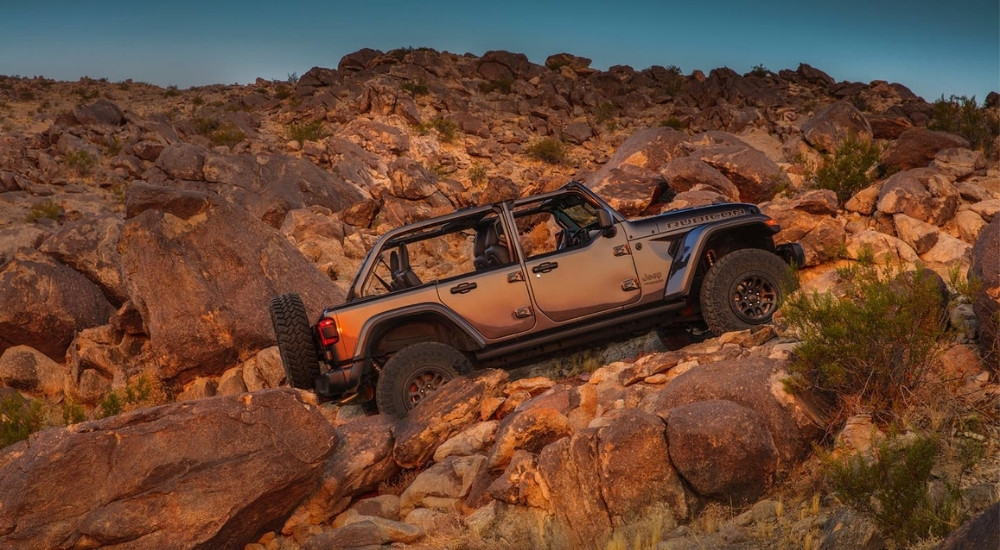 A grey 2021 Jeep Wrangler Unlimited Rubicon driving off-road.
