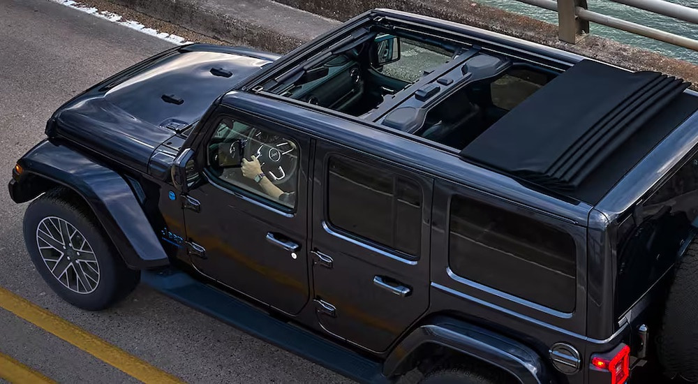 A grey 2024 Jeep Wrangler from the side.