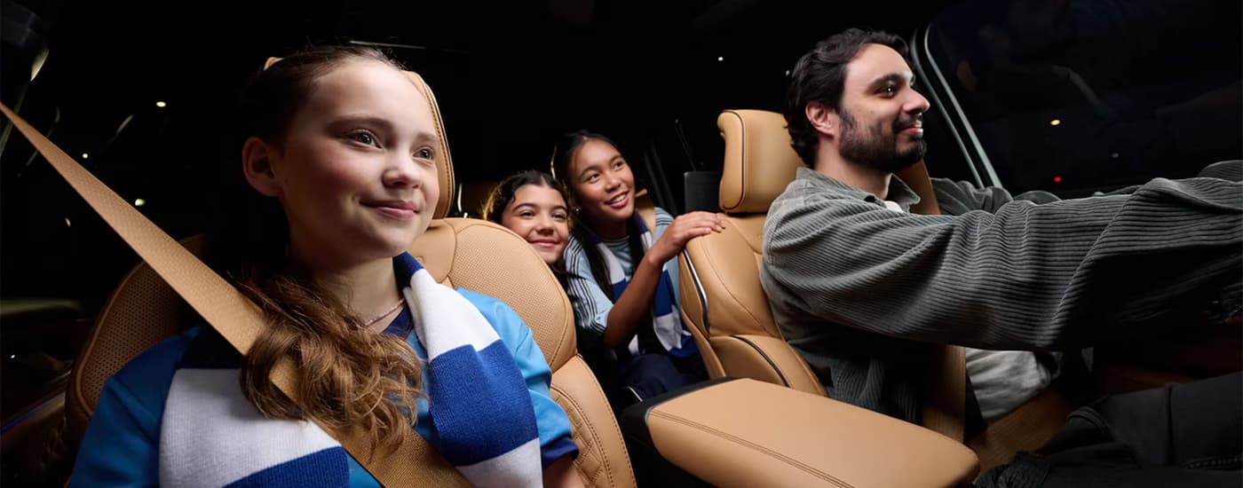 A family is driving in a 2024 Jeep Grand Cherokee after visiting a Jeep dealer near Lancaster.