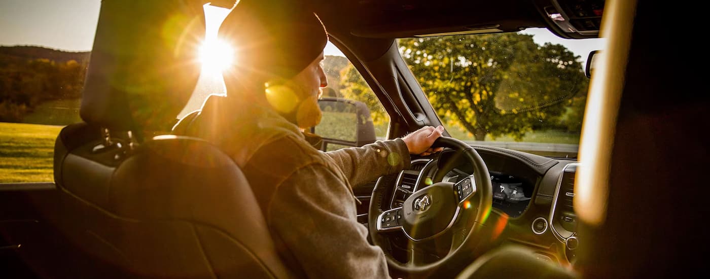 A man is driving a 2025 Ram 2500 after leaving a Ram dealer near Heath.